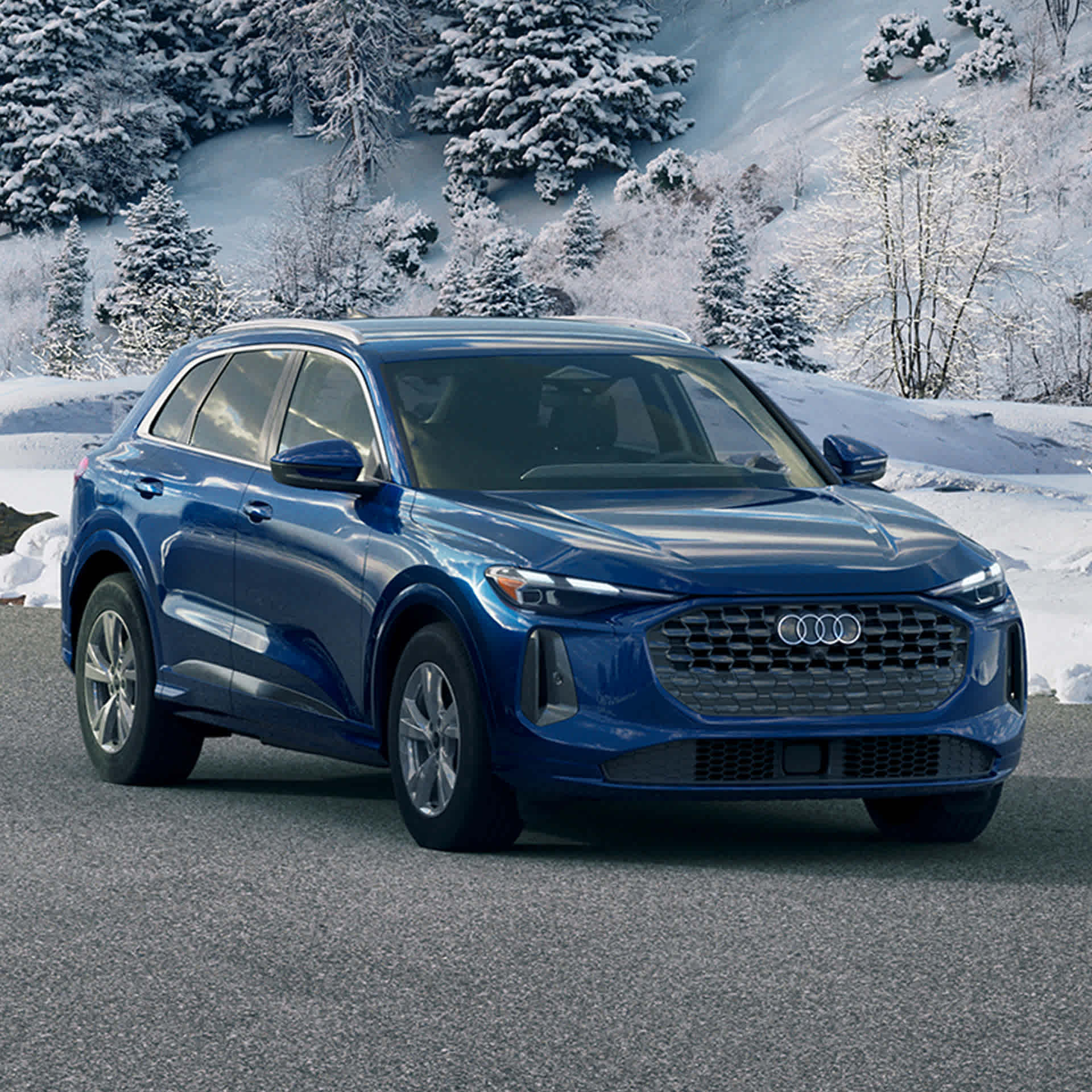 Front profile view of an Audi Q7 accelerating.